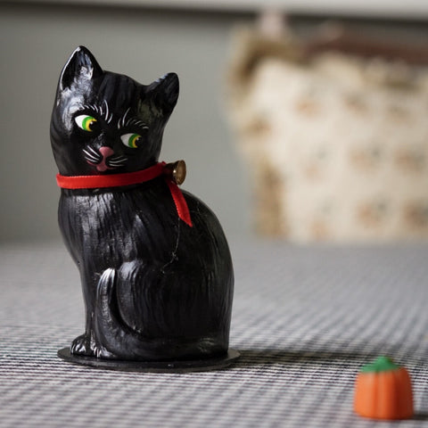 Papier-mâché Cat Decoration With A Red Ribbon Bell